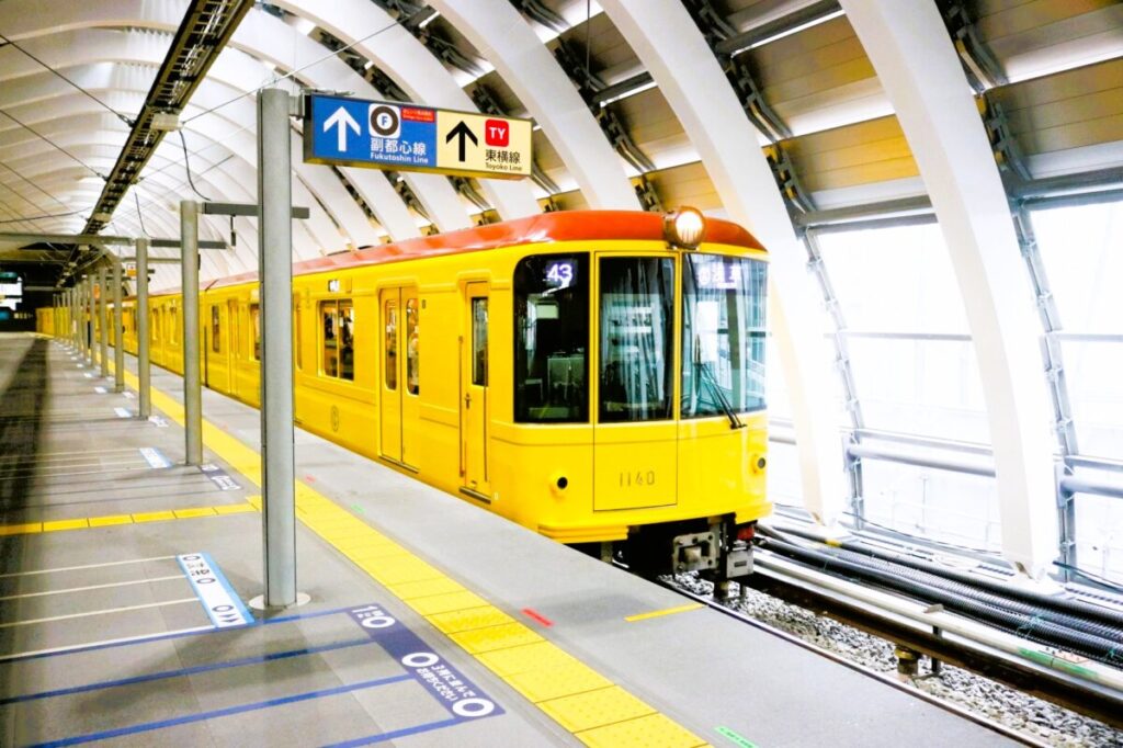 Tokyo Metro train arriving at underground platform