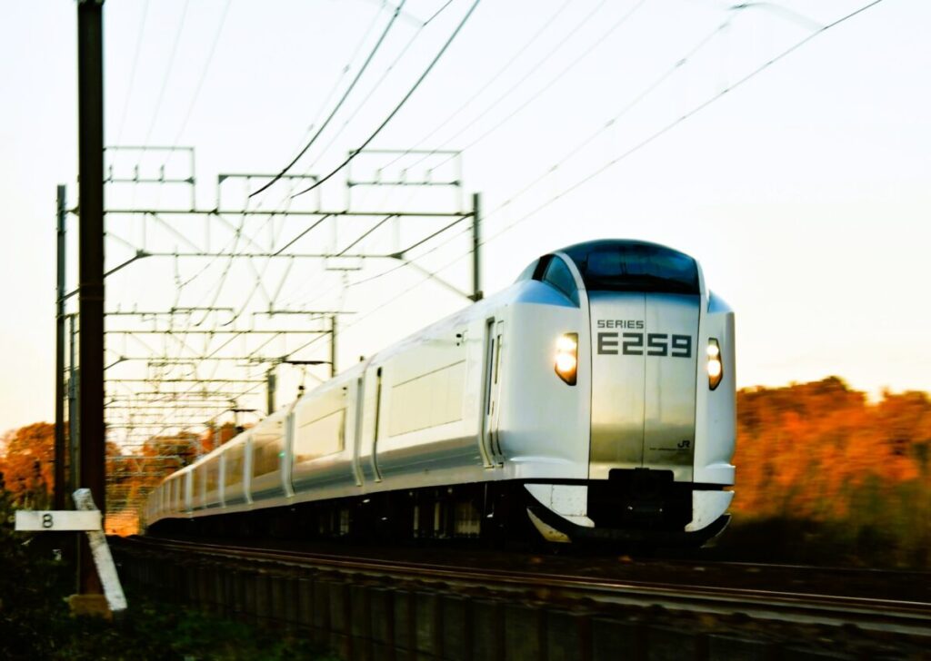 Narita Express train illuminated in evening light