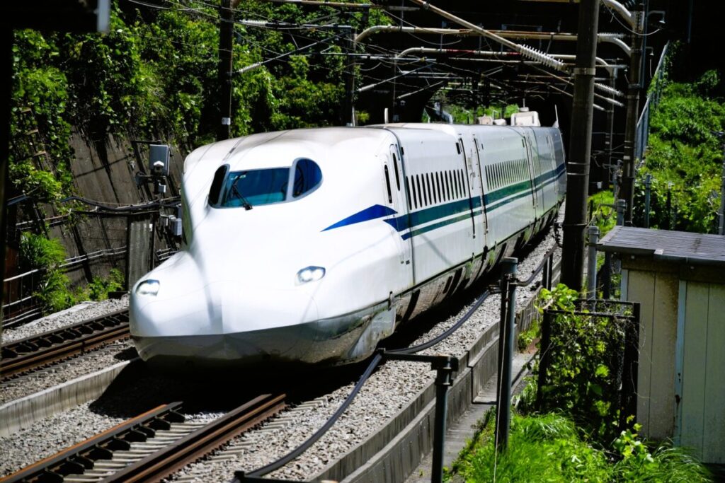 Japanese Shinkansen high-speed train arriving at the platform