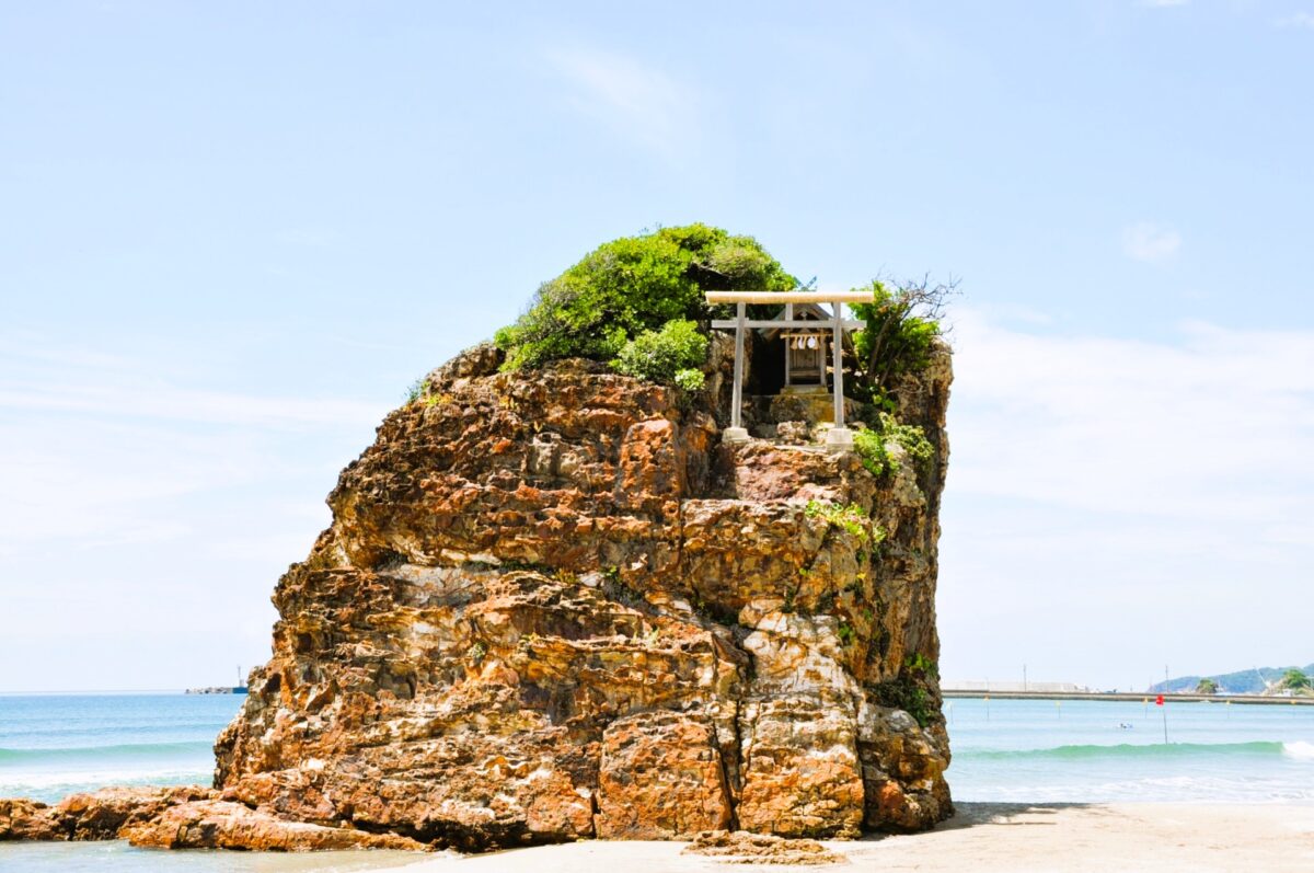 Inasa Beach with sacred torii gate at sunset in Izumo
