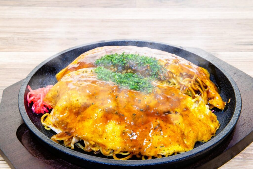 Hiroshima-style okonomiyaki layered with noodles and savory toppings