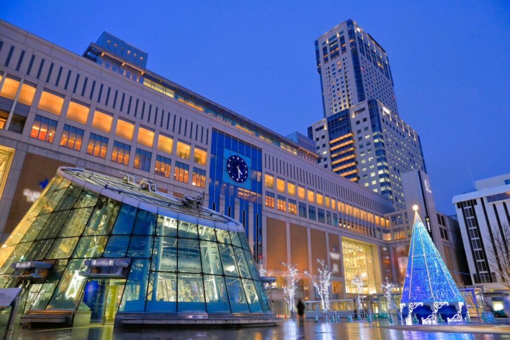 Illuminated Sapporo Station and JR Tower with winter city lights