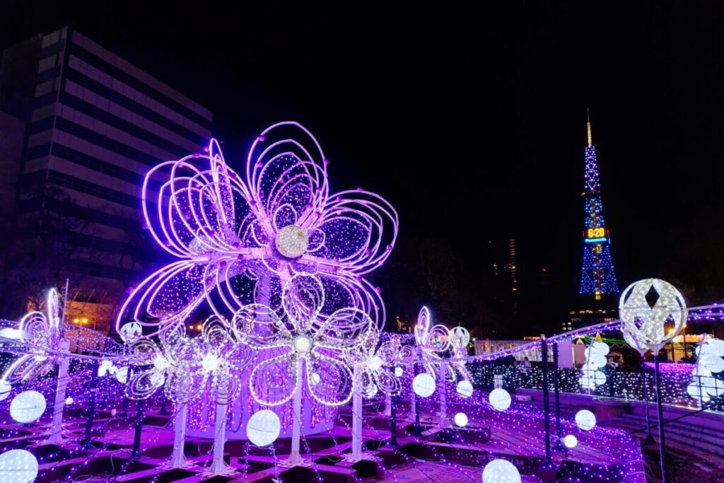 Light flower illuminations with Sapporo TV Tower at night during winter festival