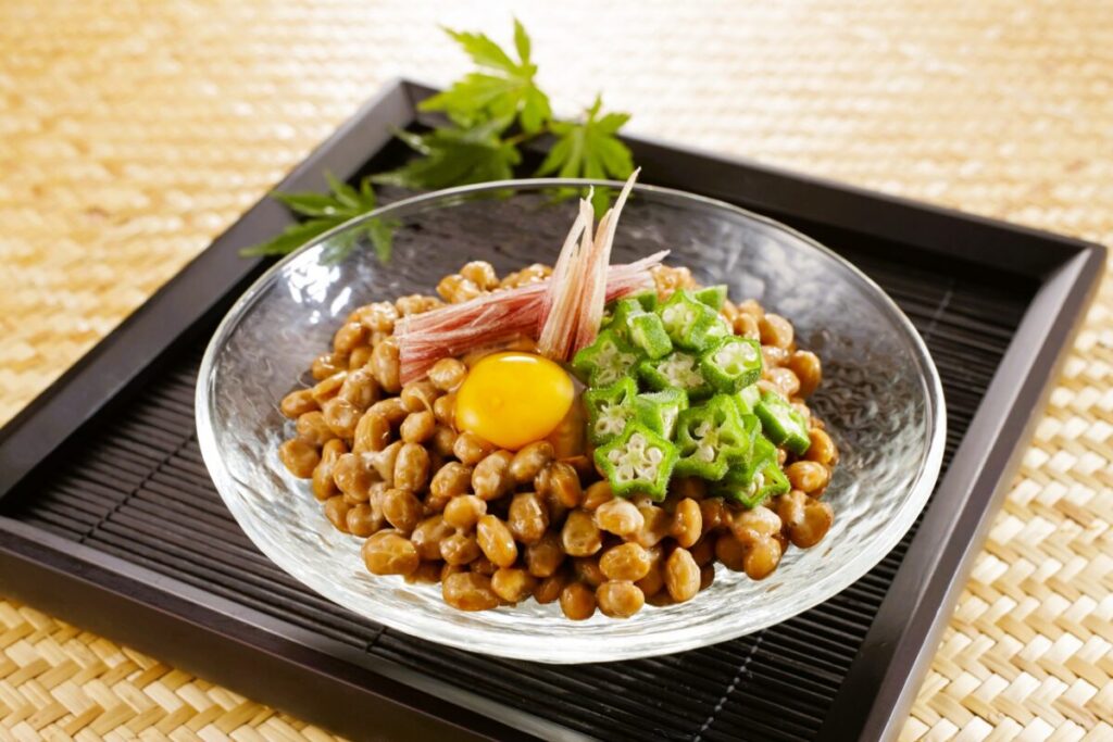 Japanese natto topped with okura, egg, and traditional seasonings