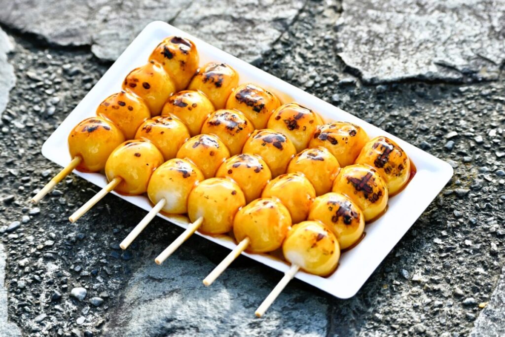 Japanese mitarashi dango rice dumplings coated with sweet soy glaze