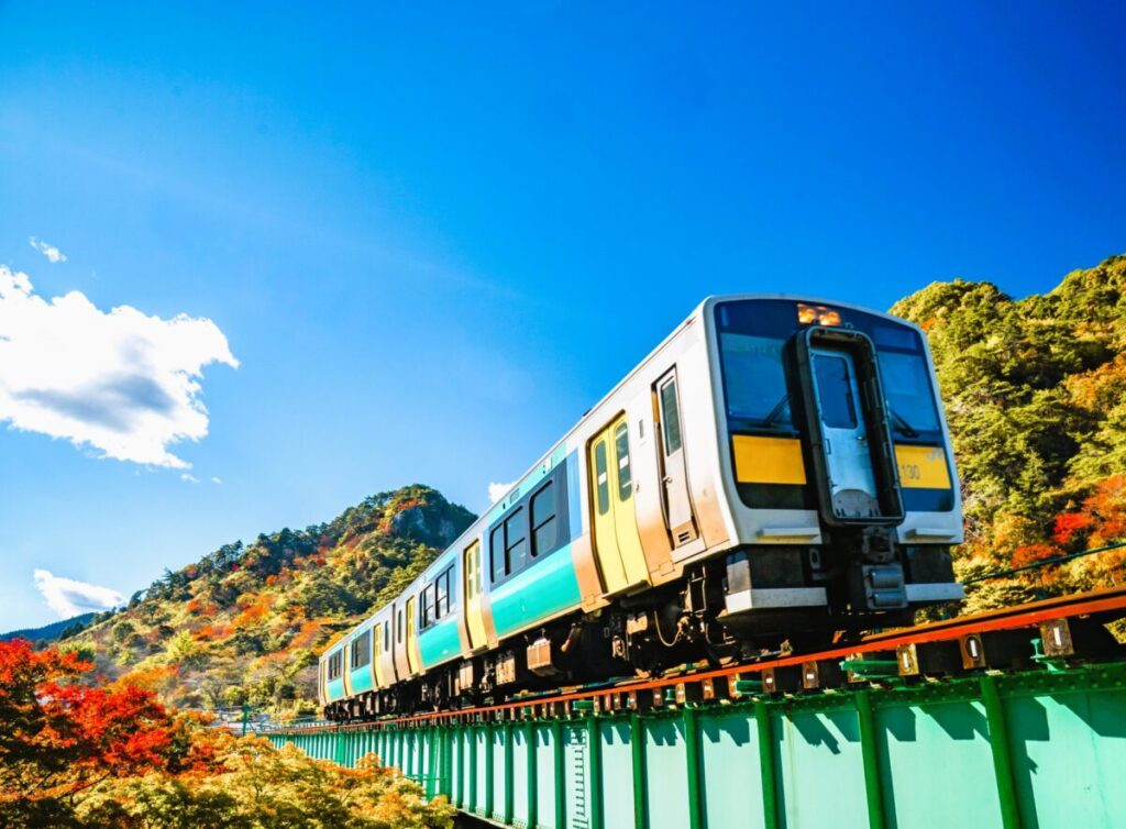 Suigun Line local train running through the rural countryside of Japan