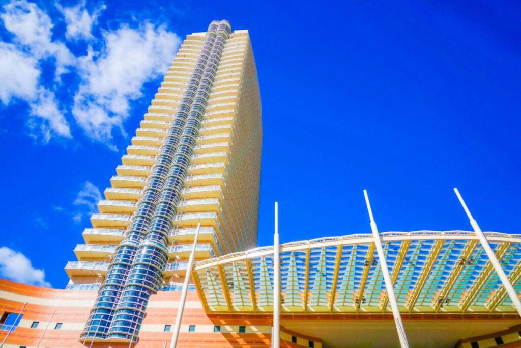 Modern tower building in Fukuoka city skyline with urban surroundings