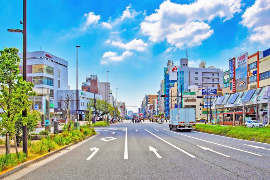 Street intersection in front of JR Sugamo Station in Tokyo, local city scenery