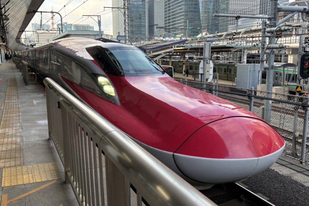 Shinkansen E6 Series bullet train in Japan, red high speed train on the Akita Shinkansen