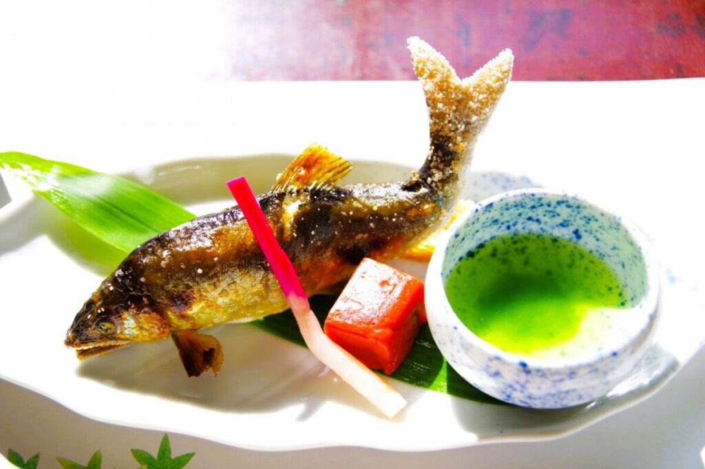 Grilled ayu sweetfish with salt, traditional Japanese seasonal dish