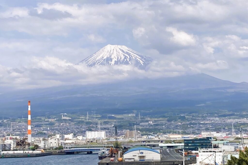 Mount Fuji covered by clouds in Japan, iconic mountain landscape view