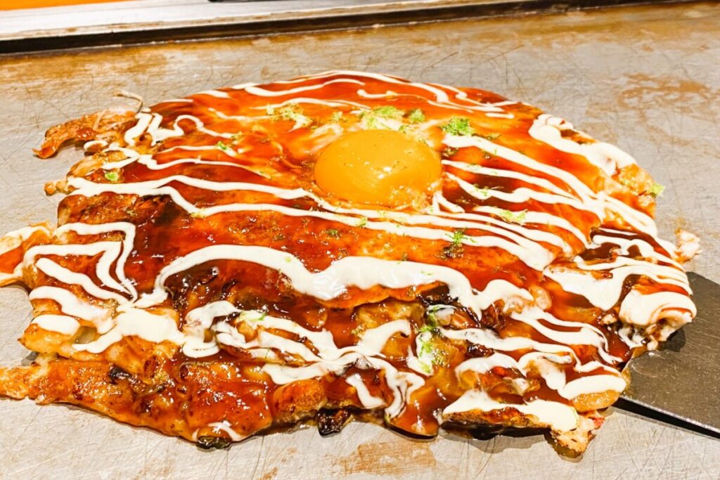 Negiyaki Japanese savory pancake with green onions, Osaka specialty dish