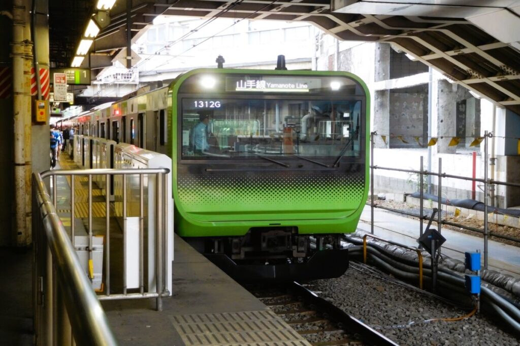 JR Yamanote Line train in Tokyo Japan, green loop commuter train