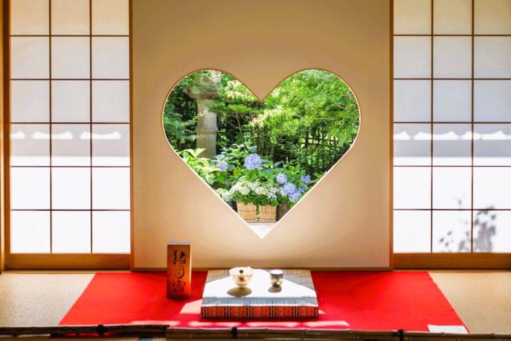 Heart shaped Inome Window at Shojuin Temple in Kyoto Japan, famous scenic temple view