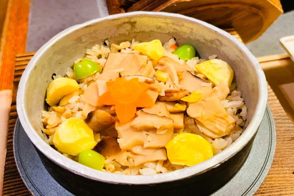Matsutake mushroom kamameshi, traditional Japanese rice cooked in an iron pot