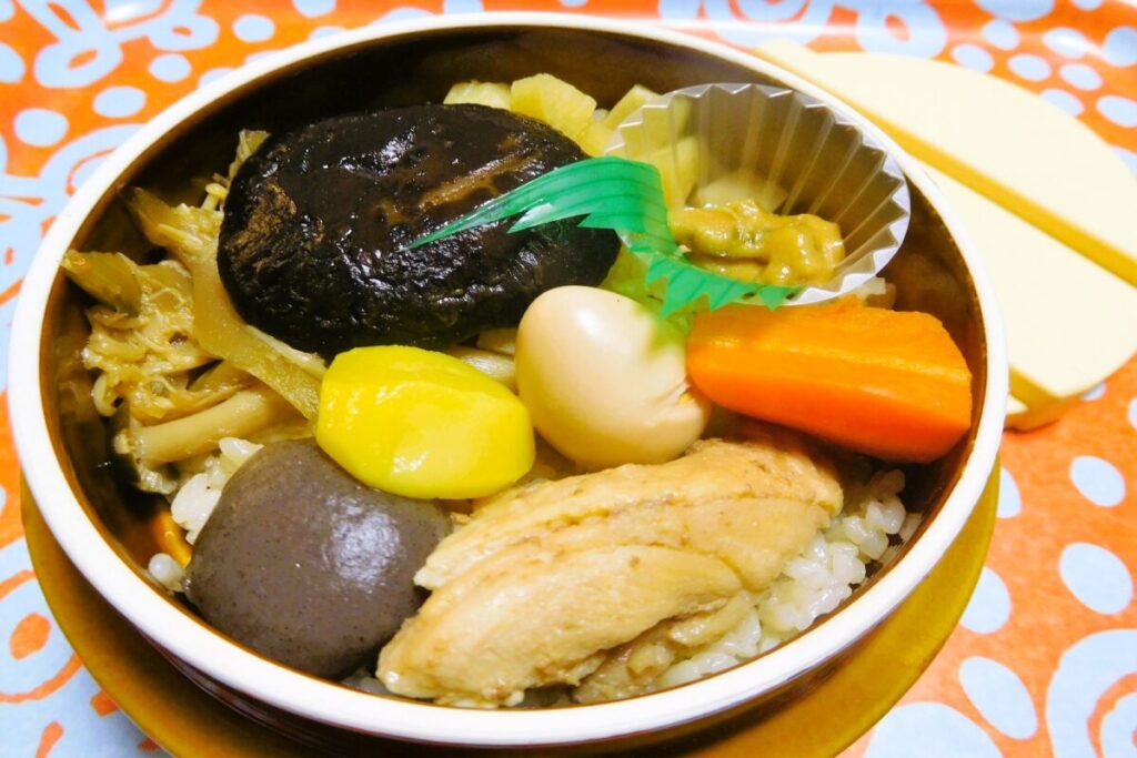 Amagi Pass kamameshi, traditional Japanese rice dish served in a small iron pot